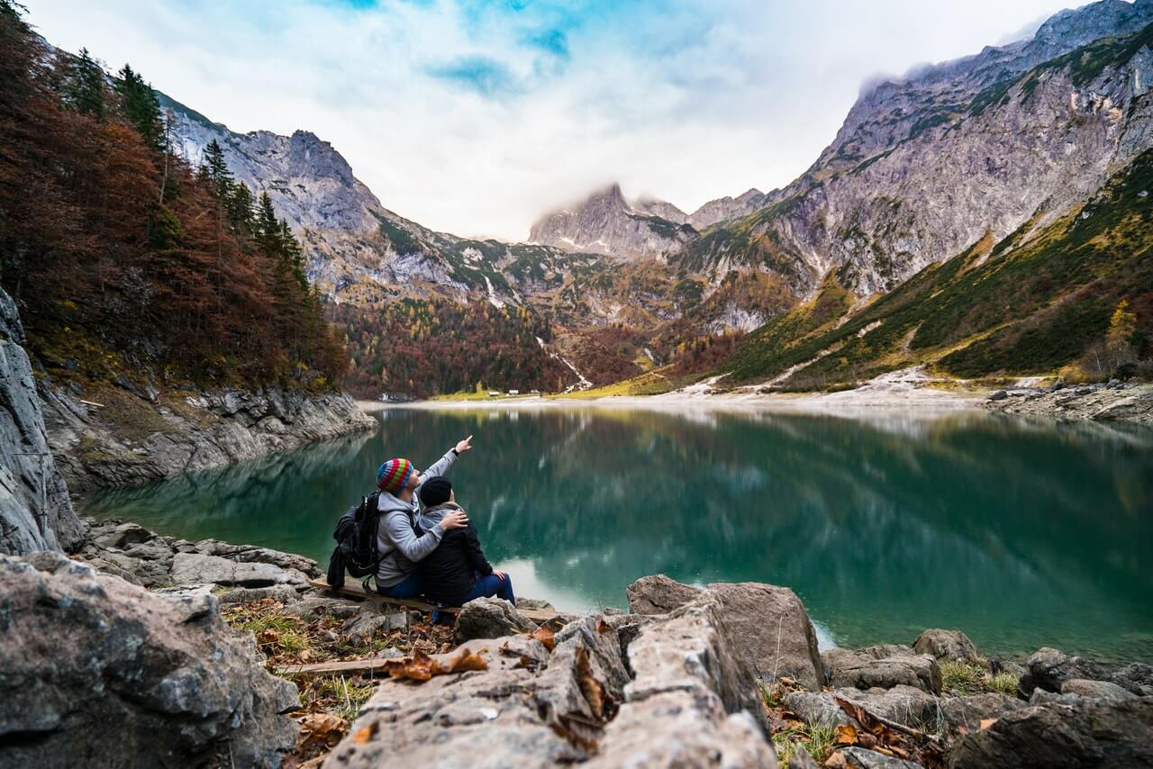 woman pointing at mountain