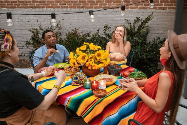 adults having a dinner party