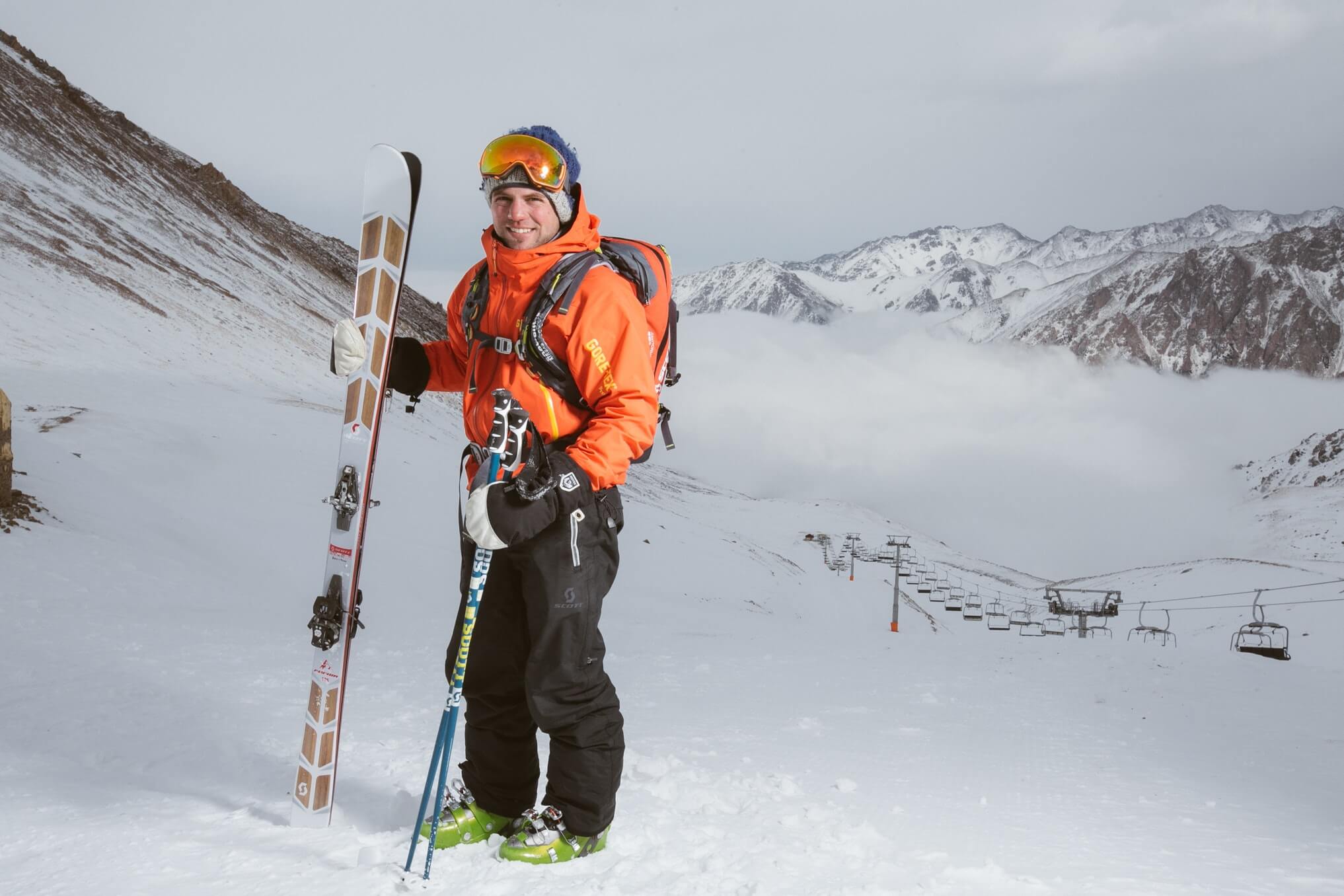 man holding skiis