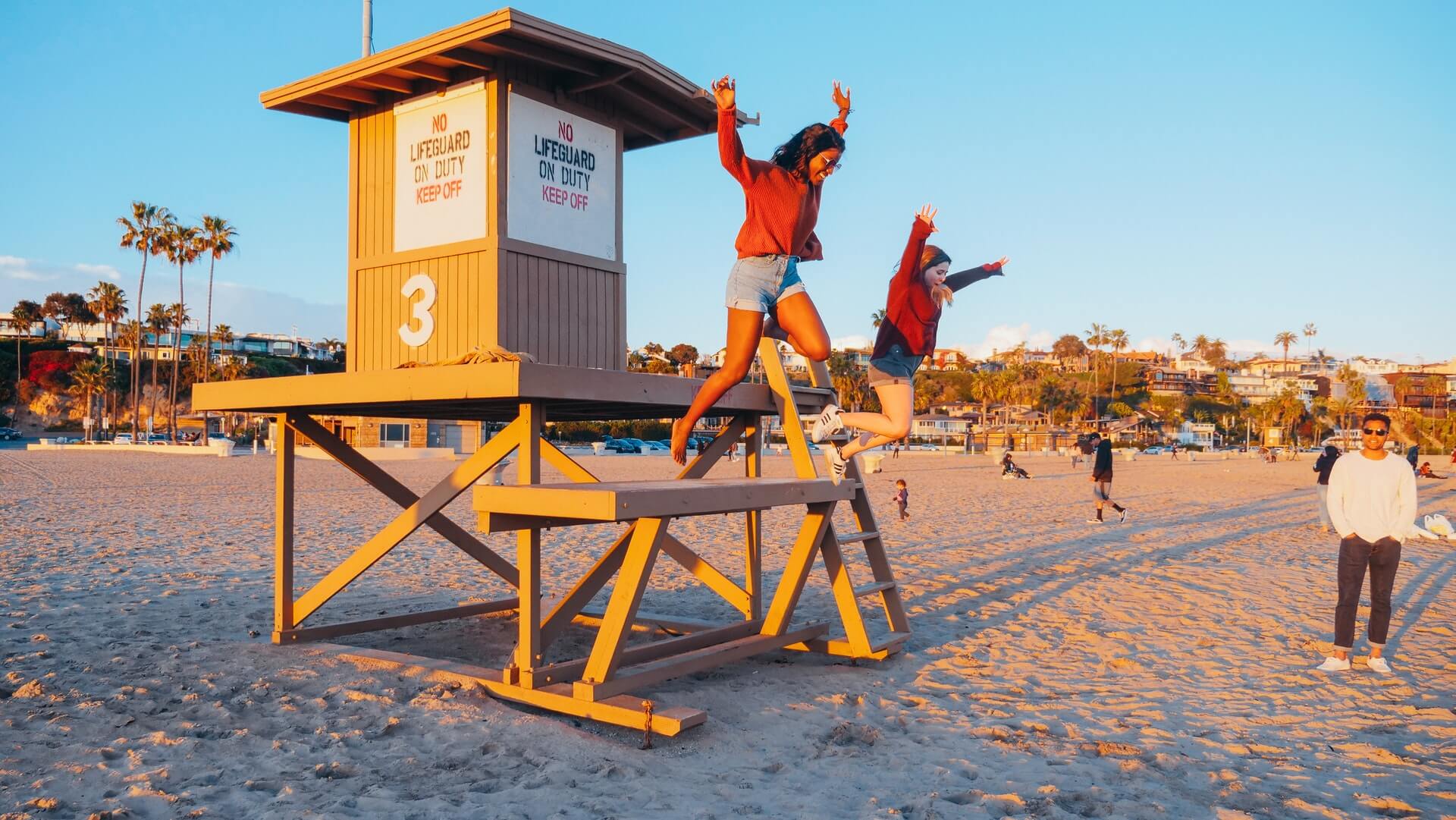 kids jumping off lifeguard station