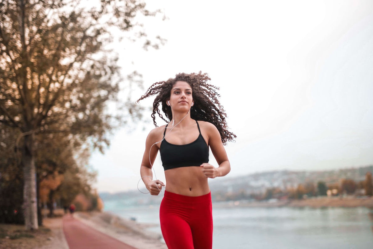 woman running by river