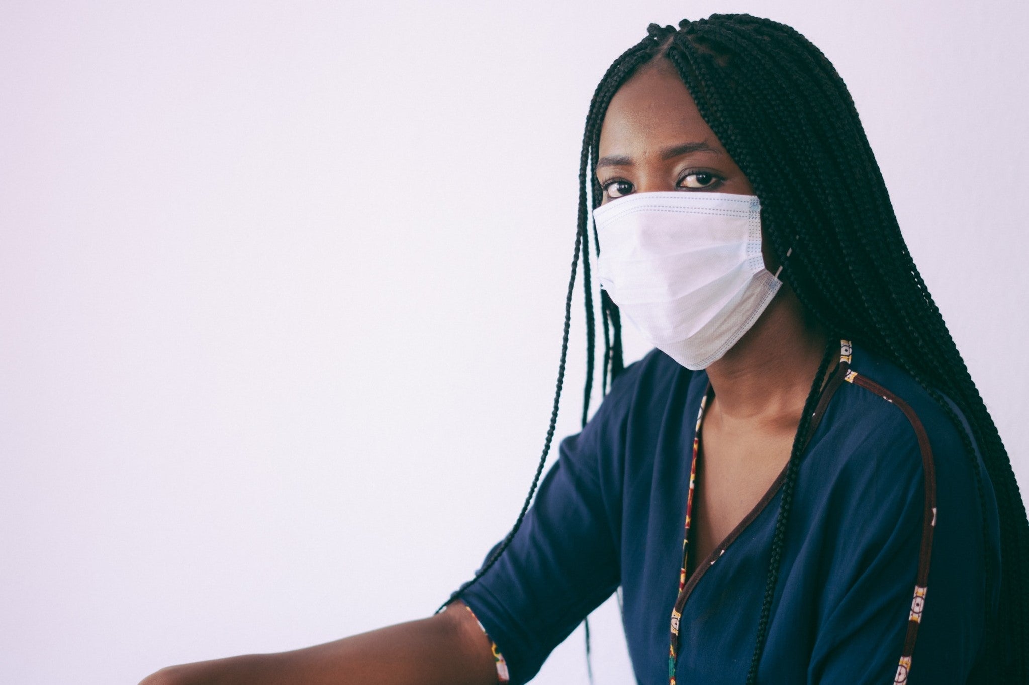 woman wearing white face mask