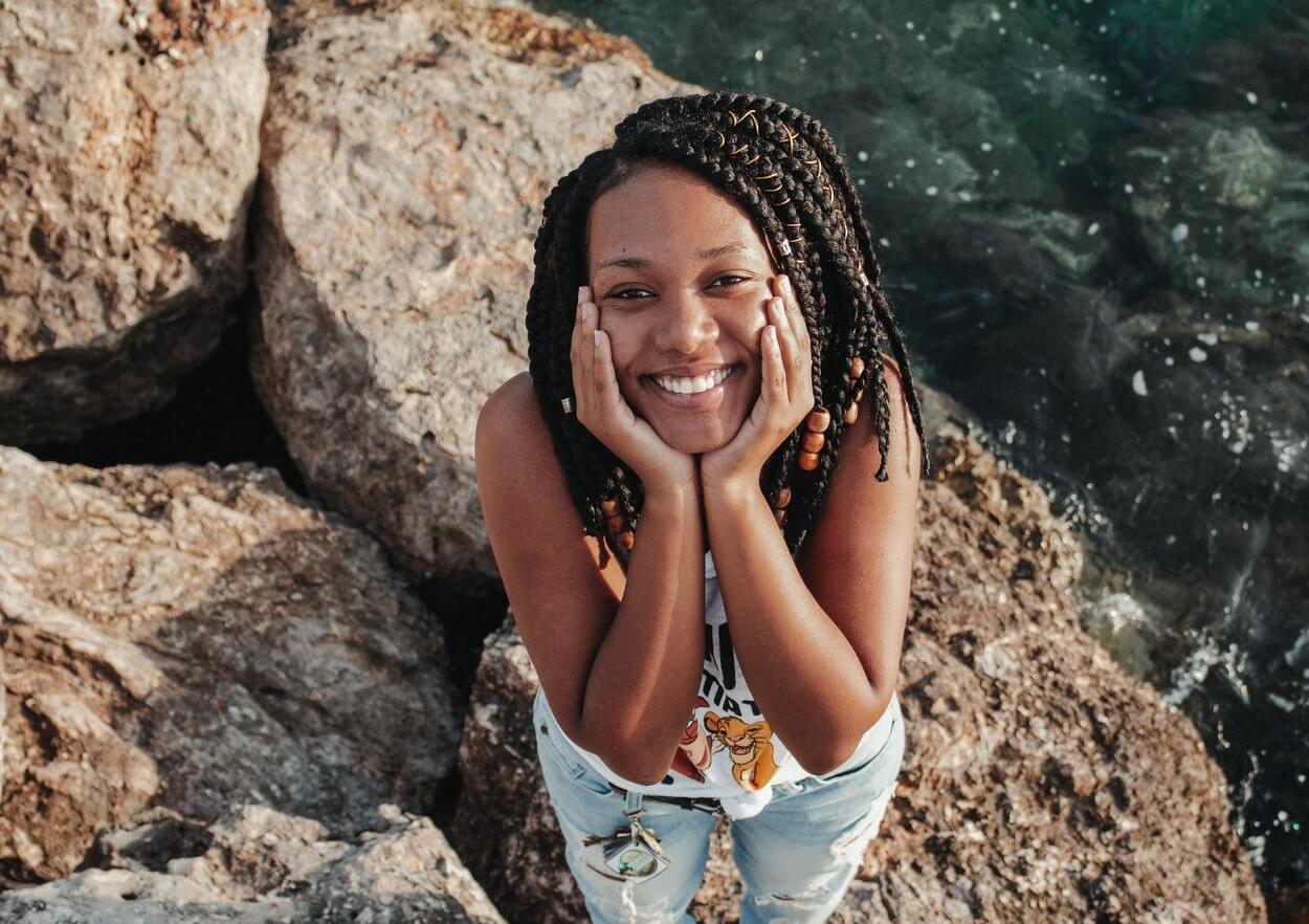 woman smiling by water